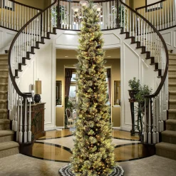 Slim-National Tree Company Pre-Lit Artificial Giant Slim Christmas Tree, Green, Carolina Pine, White Lights, Flocked With Pine Cones, Includes Stand, 12 Feet