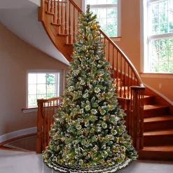 Full-National Tree Company Pre-Lit Artificial Slim Christmas Tree, Green, Glittery Bristle Pine, White Lights, Flocked With Pine Cones, Frosted Branches, Includes Stand, 9 Feet